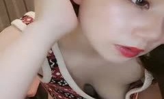 迷人小姐颜值不错大奶肥逼妹子自慰诱惑，护士情趣装黑丝翘起双脚跳蛋震动